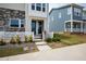 Well-maintained lawn with manicured landscaping leading to the inviting entrance with double-door entry at 249 Wendover Pkwy, Pittsboro, NC 27312