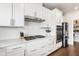 Modern white kitchen with stainless steel appliances and white subway tile backsplash at 249 Wendover Pkwy, Pittsboro, NC 27312