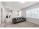 Bright living room with neutral walls, carpet, and lots of natural light from the windows at 249 Wendover Pkwy, Pittsboro, NC 27312