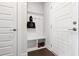Entryway mudroom featuring a bench, storage cubbies, and coat hooks by the front door at 249 Wendover Pkwy, Pittsboro, NC 27312