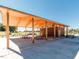 A picnic shelter with multiple tables and a building with restrooms at 249 Wendover Pkwy, Pittsboro, NC 27312
