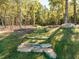 Take a peaceful stroll along the stone-step path winding through the trees at 249 Wendover Pkwy, Pittsboro, NC 27312