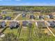 Aerial shot of the neighborhood exhibiting a home with a spacious backyard and scenic surroundings at 274 Ashpole Trl, Clayton, NC 27520