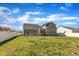 Exterior view of the home showcasing a well-maintained backyard and a charming wooden deck at 274 Ashpole Trl, Clayton, NC 27520