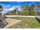 Spacious backyard featuring a brick patio and white fence, perfect for outdoor activities at 274 Ashpole Trl, Clayton, NC 27520