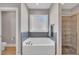 Luxurious bathroom boasts a soaking tub, glass shower, and mosaic tile accents at 274 Ashpole Trl, Clayton, NC 27520