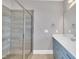 Modern bathroom featuring a glass shower, stylish vanity, and neutral color palette at 274 Ashpole Trl, Clayton, NC 27520