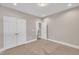 Bright bedroom featuring neutral paint, carpet floors, recessed lighting and a large double door closet at 274 Ashpole Trl, Clayton, NC 27520