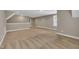 Open bonus room with neutral paint, carpet, natural light, and open floor plan at 274 Ashpole Trl, Clayton, NC 27520