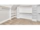 Spacious walk-in closet offering ample storage with built-in shelving and hanging rods at 274 Ashpole Trl, Clayton, NC 27520