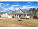 Beautiful home with a covered front porch, two-car garage, and well-maintained landscaping at 274 Ashpole Trl, Clayton, NC 27520