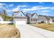 Lovely home featuring an attached two-car garage, spacious driveway, and manicured lawn at 274 Ashpole Trl, Clayton, NC 27520