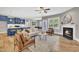 Inviting living room with fireplace and view to kitchen, creating an ideal entertaining space at 274 Ashpole Trl, Clayton, NC 27520