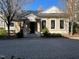Charming clubhouse with a welcoming entrance, white columns, and well-maintained landscaping at 2801 Glenwood Gardens Ln # 106, Raleigh, NC 27608