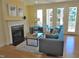 Stylish living room with a fireplace, comfortable seating, and access to a balcony at 2801 Glenwood Gardens Ln # 106, Raleigh, NC 27608