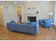 Cozy living room with a fireplace, modern furniture, and hardwood floors at 2801 Glenwood Gardens Ln # 106, Raleigh, NC 27608