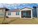 Backyard featuring a screened porch ideal for outdoor relaxation and entertaining, and a lawn at 296 Providence Creek Dr, Fuquay Varina, NC 27526