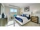 Bright bedroom with a large window, stylish decor, and a comfortable seating area at 296 Providence Creek Dr, Fuquay Varina, NC 27526