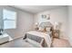 Bedroom featuring a decorative bed, side tables, and lamps at 296 Providence Creek Dr, Fuquay Varina, NC 27526