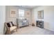 Cozy Bedroom featuring a crib, chair, and decor at 296 Providence Creek Dr, Fuquay Varina, NC 27526