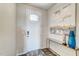 A bright entryway features a white door with glass, hardwood floors, and a decoratively adorned table at 296 Providence Creek Dr, Fuquay Varina, NC 27526