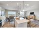 Bright kitchen and dining area with an island and open to the living room, perfect for gatherings at 296 Providence Creek Dr, Fuquay Varina, NC 27526