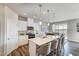 Well-equipped kitchen with modern appliances, a large island, and ample cabinet space at 296 Providence Creek Dr, Fuquay Varina, NC 27526