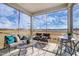 Relaxing screened porch furnished with cozy seating, perfect for enjoying the views at 296 Providence Creek Dr, Fuquay Varina, NC 27526