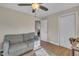 This bedroom has a sofa and a closet, with an open door to another bedroom at 3022 Dixon Rd, Durham, NC 27707