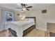 Comfortable bedroom with a ceiling fan, large window, and a serene atmosphere at 3022 Dixon Rd, Durham, NC 27707