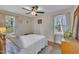 Comfortable bedroom with windows on two walls, a soft rug, and natural light at 3022 Dixon Rd, Durham, NC 27707
