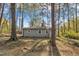 Wooded lot view of a single story home and driveway at 3022 Dixon Rd, Durham, NC 27707