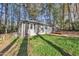 Exterior view of a charming home with a well-maintained yard and classic architecture surrounded by beautiful trees at 3022 Dixon Rd, Durham, NC 27707