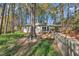 This is a charming home featuring a covered carport, small deck and lovely yard, nestled in a wooded, natural setting at 3022 Dixon Rd, Durham, NC 27707