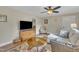 Comfortable living room featuring a cozy seating area, stylish decor, ceiling fan, and hardwood floors for modern living at 3022 Dixon Rd, Durham, NC 27707