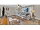 Inviting living room featuring hardwood floors, lots of light and a comfortable seating area with stylish decor at 3022 Dixon Rd, Durham, NC 27707