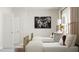 Bright bedroom with twin beds, neutral walls, and simple decor at 316 Canyon Spring Trl, Wake Forest, NC 27587