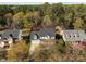 An aerial view of a lovely home with mature trees and a well-manicured lawn in a neighborhood at 317 Flatrock Ln, Holly Springs, NC 27540