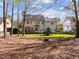 Expansive backyard with playset, fire pit and ample green space at 317 Flatrock Ln, Holly Springs, NC 27540