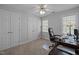 Bedroom featuring a desk, ceiling fan and closet space at 317 Flatrock Ln, Holly Springs, NC 27540