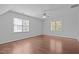 Bonus room with hardwood floors, lots of natural light and a ceiling fan at 317 Flatrock Ln, Holly Springs, NC 27540