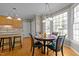 Bright kitchen nook with a circular table near a large bay window at 317 Flatrock Ln, Holly Springs, NC 27540