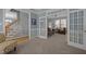 Cozy Living room with an open floor plan featuring French doors at 317 Flatrock Ln, Holly Springs, NC 27540