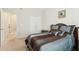 Inviting bedroom featuring a plush bed with decorative pillows and natural light from the doorway at 3213 Kirby St, Durham, NC 27713