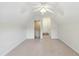 Bonus room featuring a ceiling fan, stairs, and a neutral color scheme at 3213 Kirby St, Durham, NC 27713