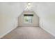 Spacious bonus room with a large window offering a view of the outdoors at 3213 Kirby St, Durham, NC 27713