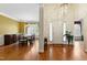 Bright entryway featuring hardwood floors, a chandelier, and views into the dining room at 3213 Kirby St, Durham, NC 27713
