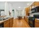 Traditional eat-in kitchen boasts wood cabinets, stainless steel appliances, and hardwood floors at 3213 Kirby St, Durham, NC 27713