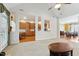 Bright living room with neutral carpet and an open concept view to kitchen and dining room at 3213 Kirby St, Durham, NC 27713