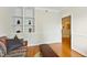 Relaxing living room showcasing built-in shelves and hardwood floors, with a calming atmosphere at 3213 Kirby St, Durham, NC 27713